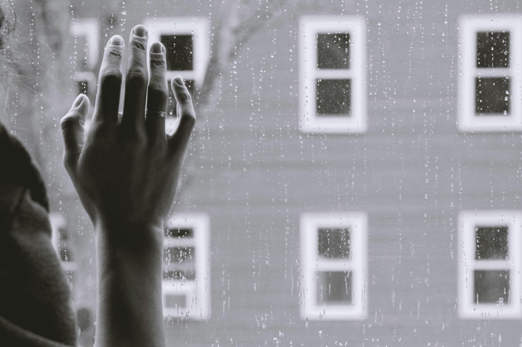 grayscale-photo-of-woman-right-hand-on-glass